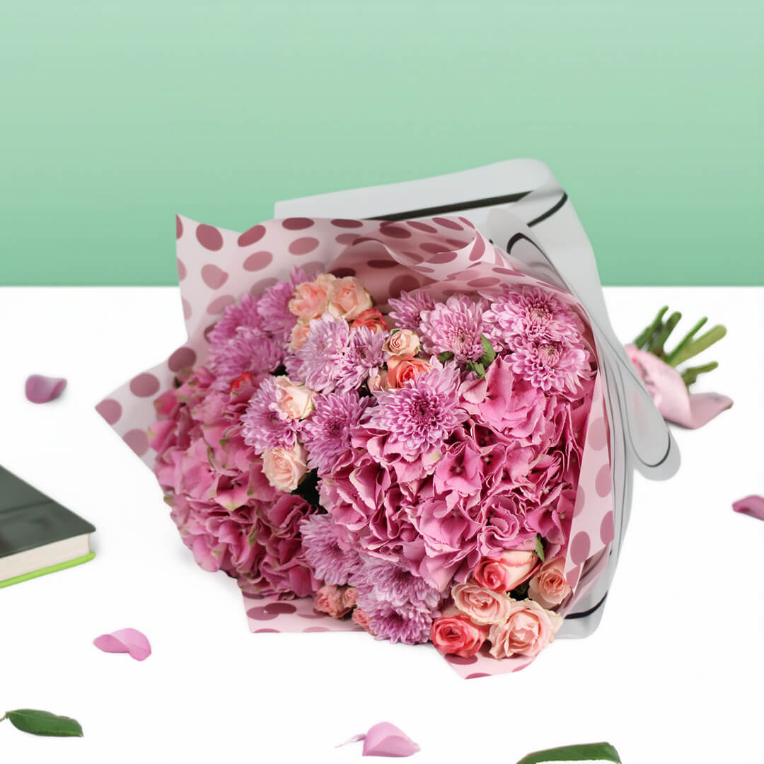 Pink Hydrangeas, Roses, Spray Roses and Chrysanthemums wrapped in Korean-style flower sheets.