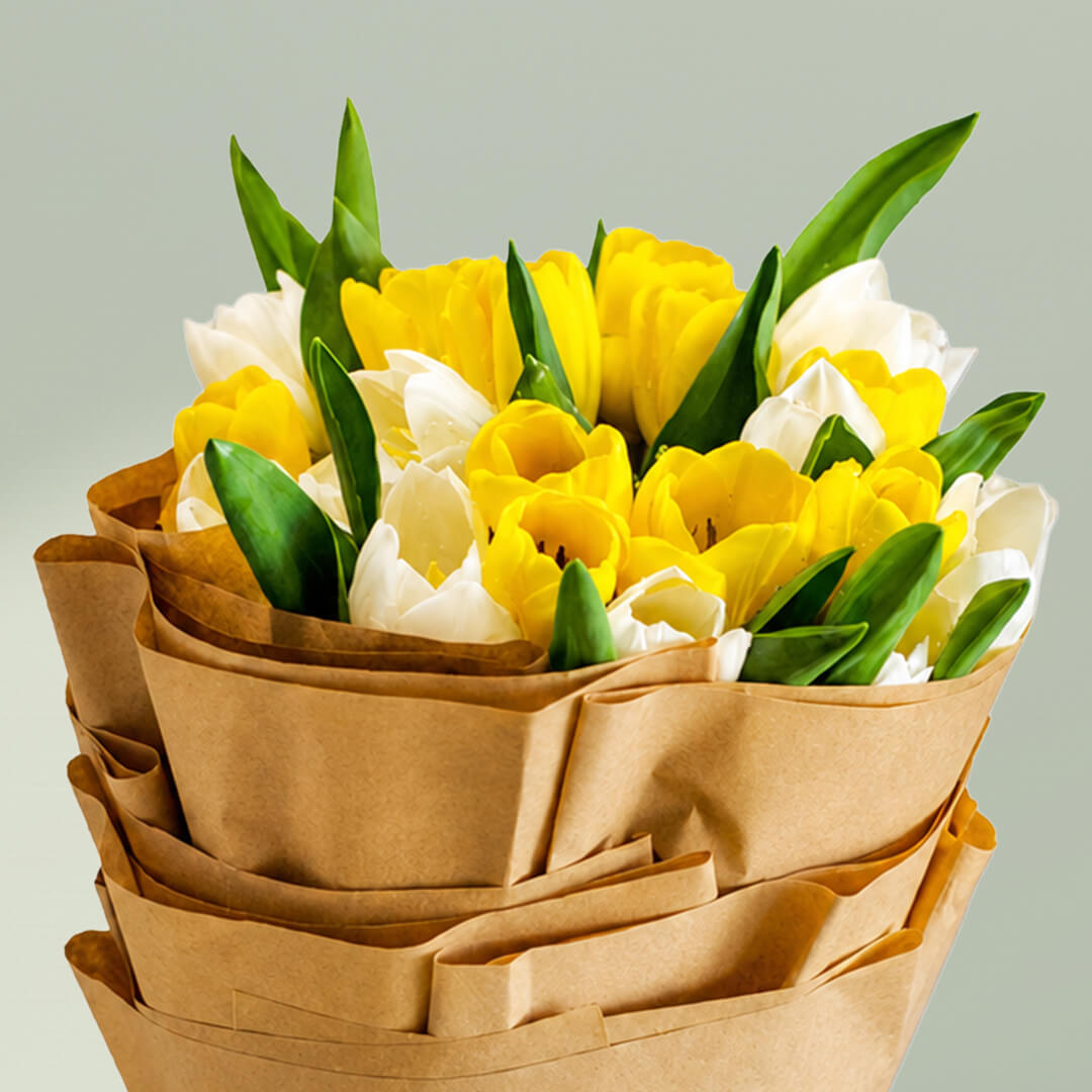 Cheerful yellow and white tulips bouquet with 20 fresh tulip stems wrapped in premium non-woven paper