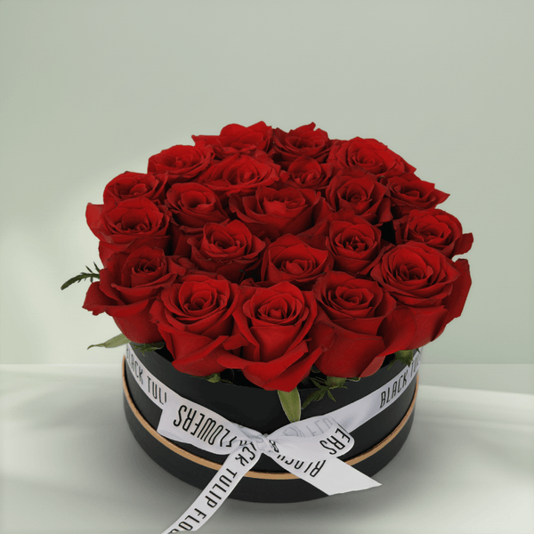 Crimson red rose box with 20 fresh roses in a black round gift box