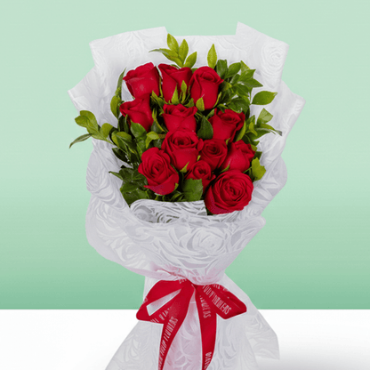 Red Roses Bouquet arranged with 12 red roses with fresh green foliage