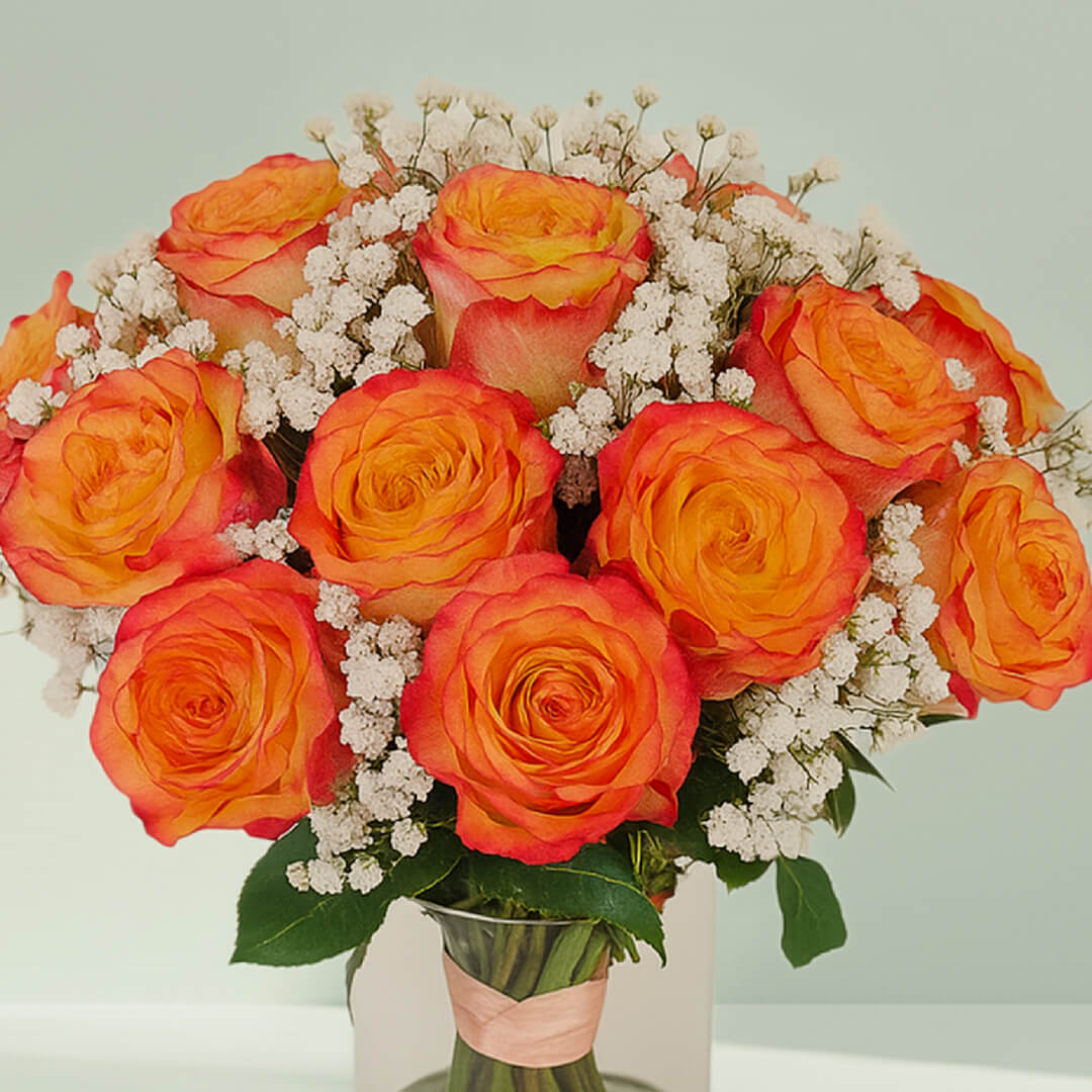Orange Roses in Glass Vase arranged with 20 orange roses, gypso and fresh greenery