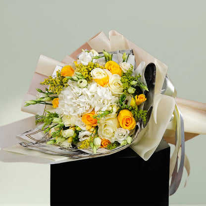 Dazzling white and yellow flower bouquet arranged with fresh blooms