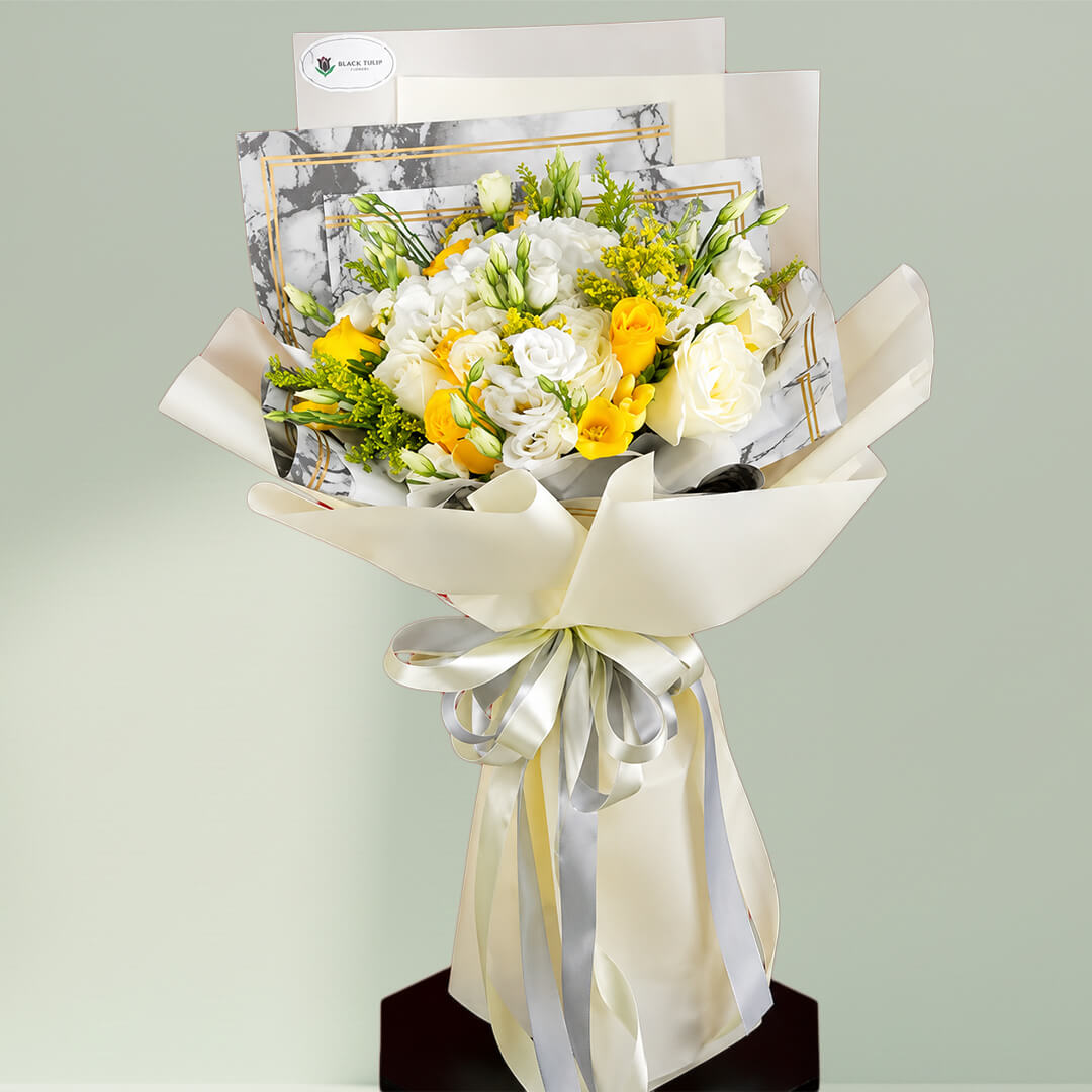 Dazzling white and yellow flower bouquet arranged with fresh blooms