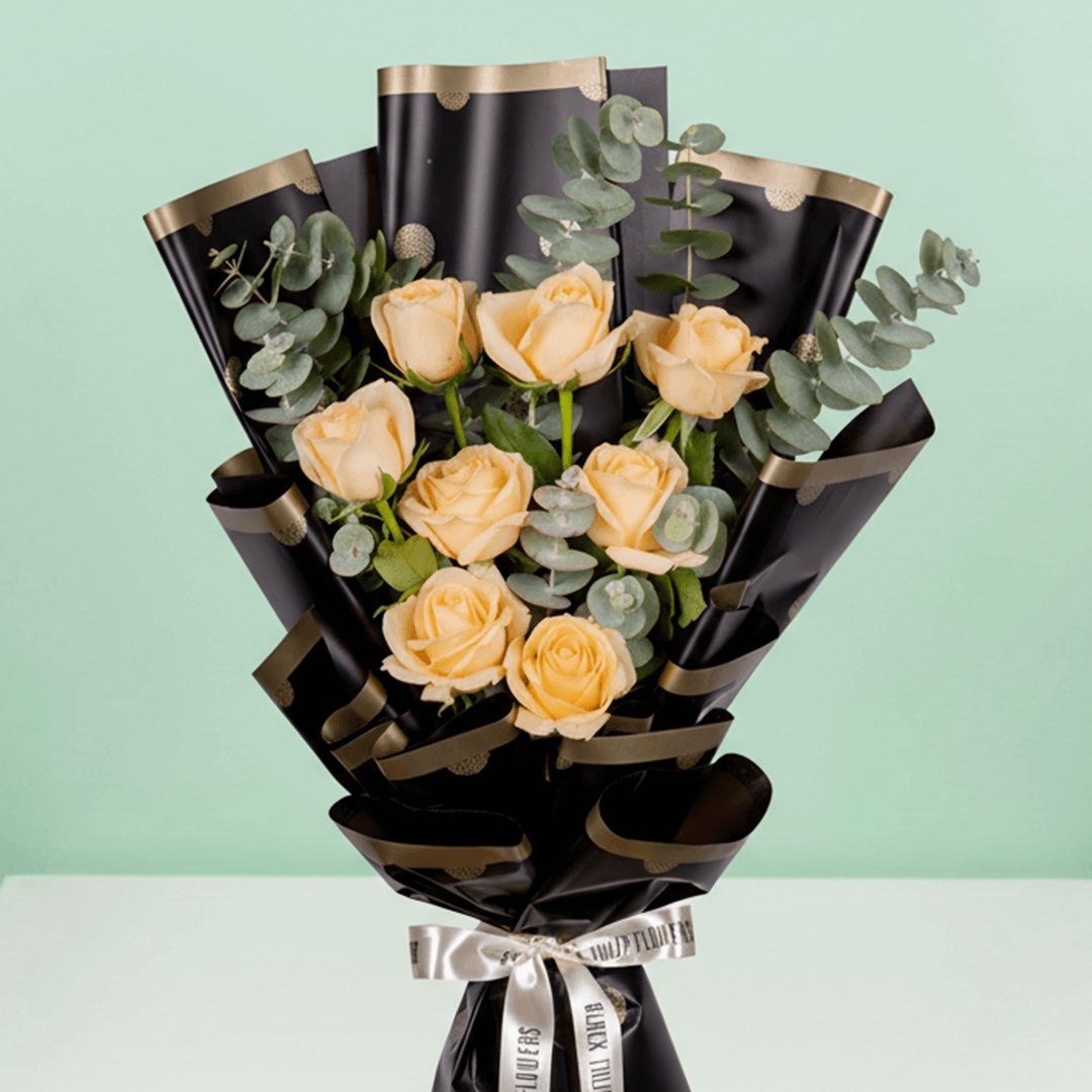 8 pink roses with gypsophila wrapped in pastel Korean floral paper.