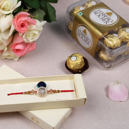 Pink and white Roses bouquet with greenery, one Peacock Rakhi and a box of 16 Ferrero Rocher chocolates.
