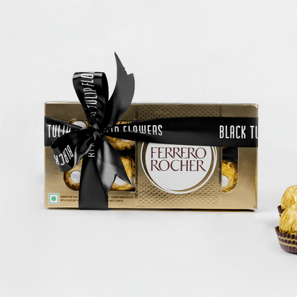Gift box containing 8 Ferrero Rocher chocolates finished with a black ribbon.