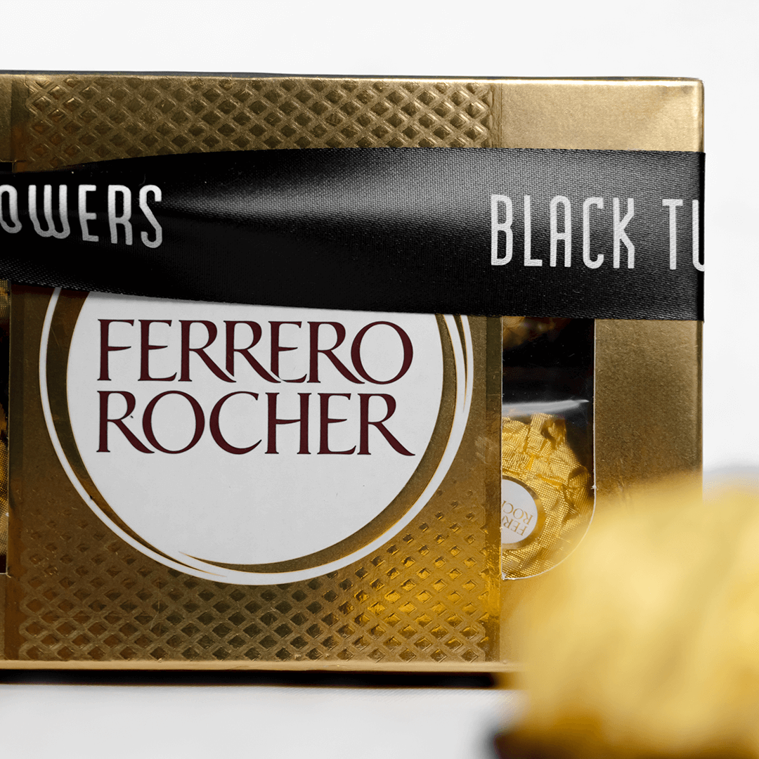 Gift box containing 8 Ferrero Rocher chocolates finished with a black ribbon.