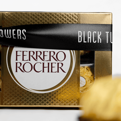 Gift box containing 8 Ferrero Rocher chocolates finished with a black ribbon.
