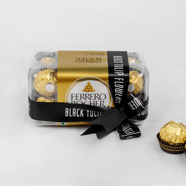 Gift box containing 16 Ferrero Rocher chocolates in elegant packaging.