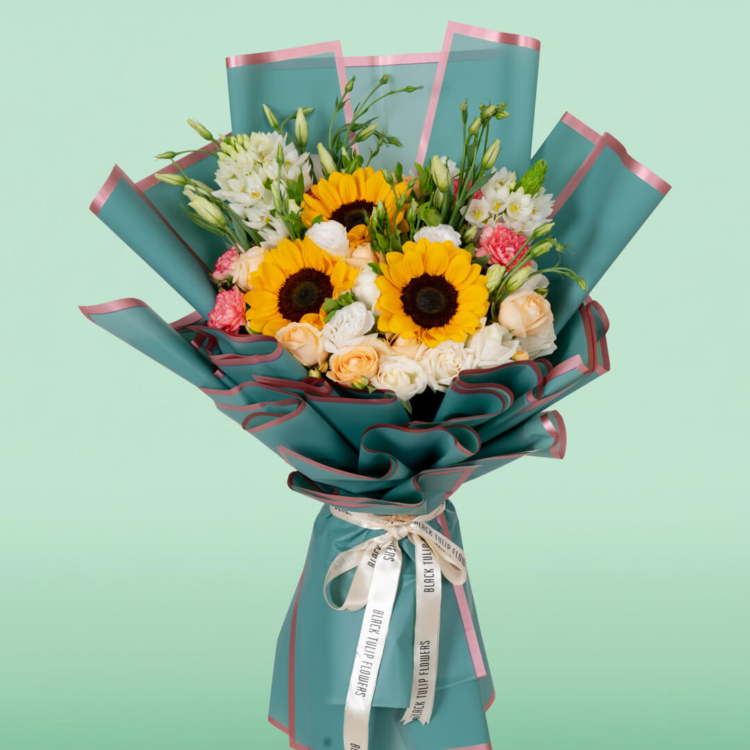 Assorted sunflower, rose, Eustoma and carnation bouquet in teal Korean wrapping
