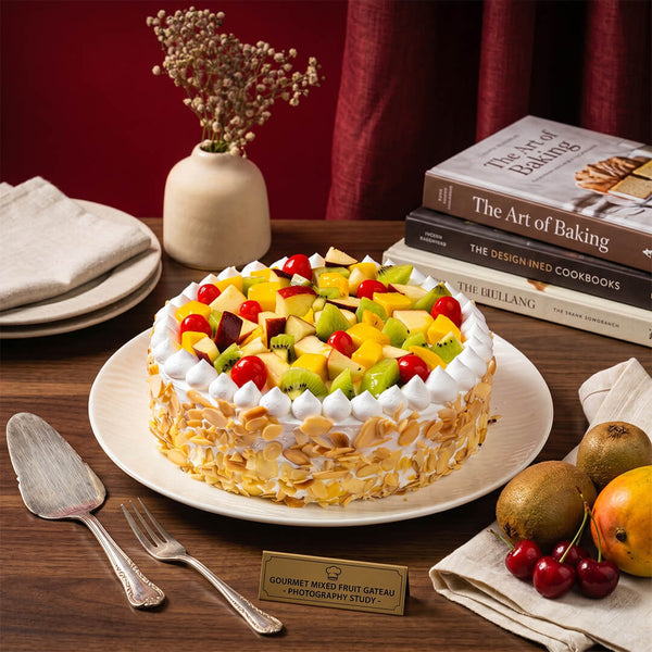 Fresh fruit cake topped with dragon fruit, mango, kiwi, grapes, strawberries and whipped cream, finished with almond flakes.