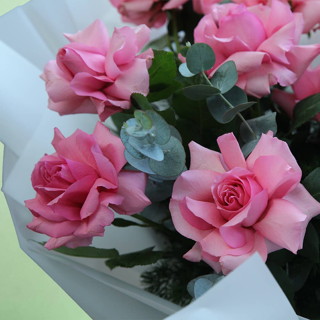 A beautiful bouquet of fresh pink roses, elegantly arranged with delicate foliage and wrapped in soft non-woven paper. The graceful pink colour makes it a thoughtful gift for birthdays, anniversaries, congratulations or heartfelt surprises.