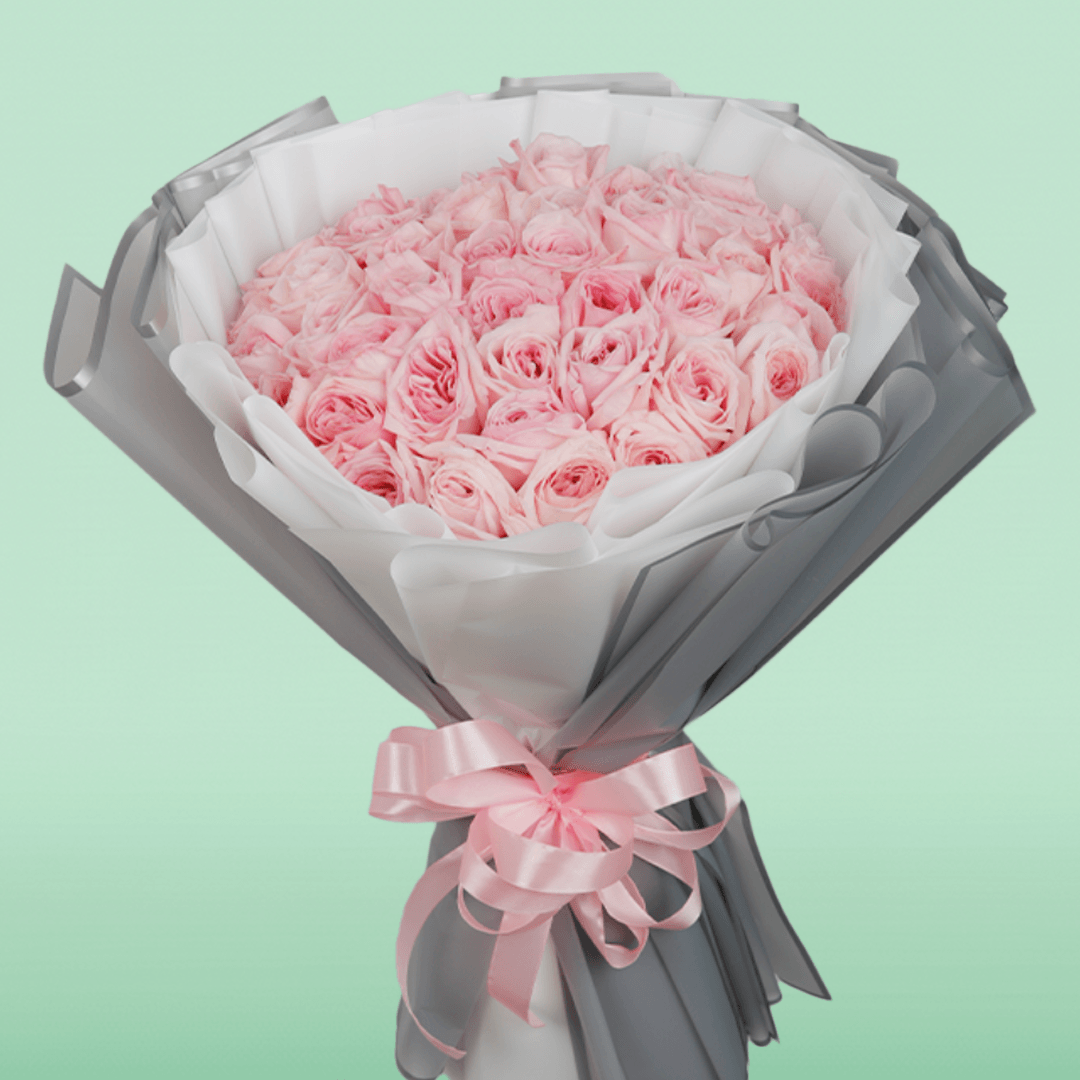 Large bouquet of 50 light pink roses in layered grey and white non-woven wrapping
