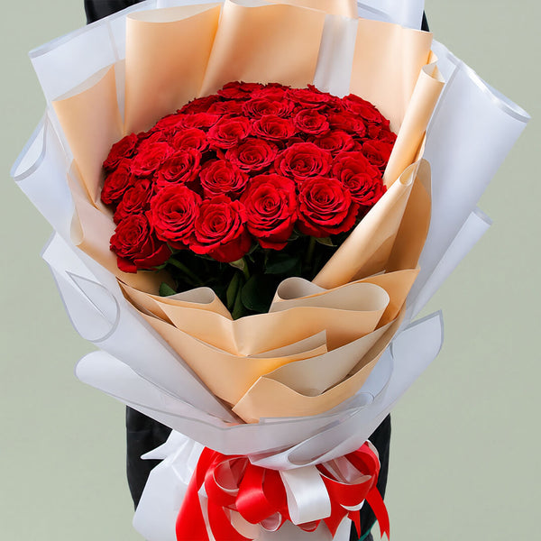 40 red roses arranged in peach, grey and white layered non-woven wrapping
