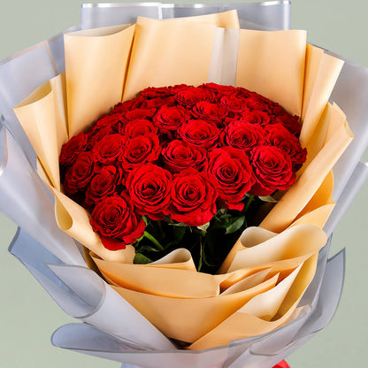 40 red roses arranged in peach, grey and white layered non-woven wrapping