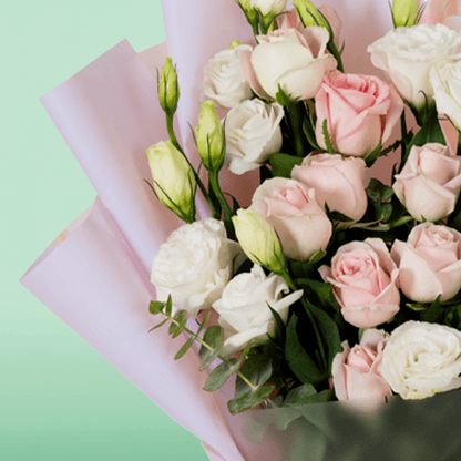 Pink Roses and white Eustoma in soft pink Korean-style wrapping with a decorative “Mom” topper.