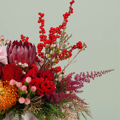 Harmony Bloom assorted flower bouquet with Pincushion, Protea Queen, Ilex, Astilbe, Skimmia, Amaranthus, Dusty Miller, pink berries and Wax flowers – 25 to 30 stems.