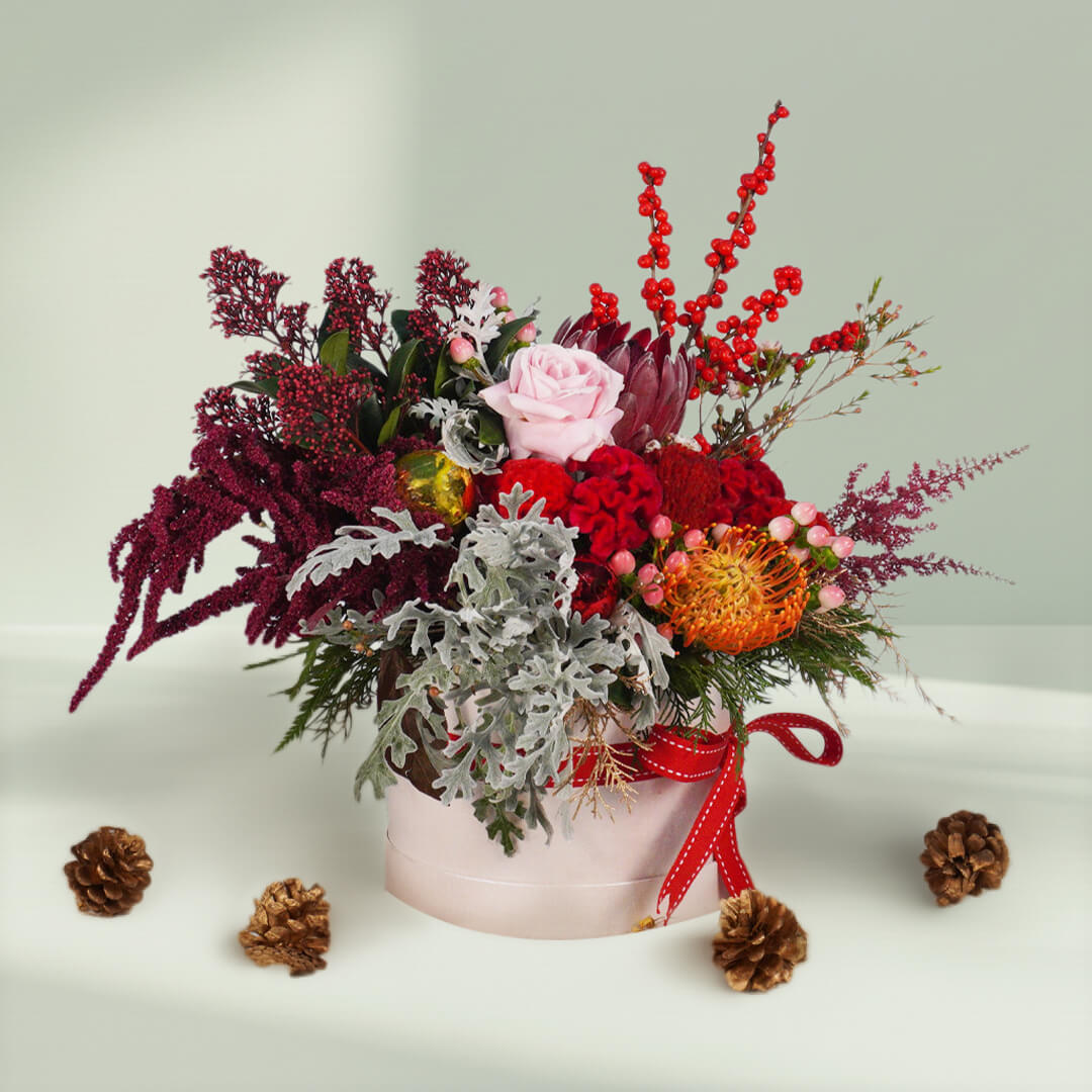 Harmony Bloom assorted flower bouquet with Pincushion, Protea Queen, Ilex, Astilbe, Skimmia, Amaranthus, Dusty Miller, pink berries and Wax flowers – 25 to 30 stems.