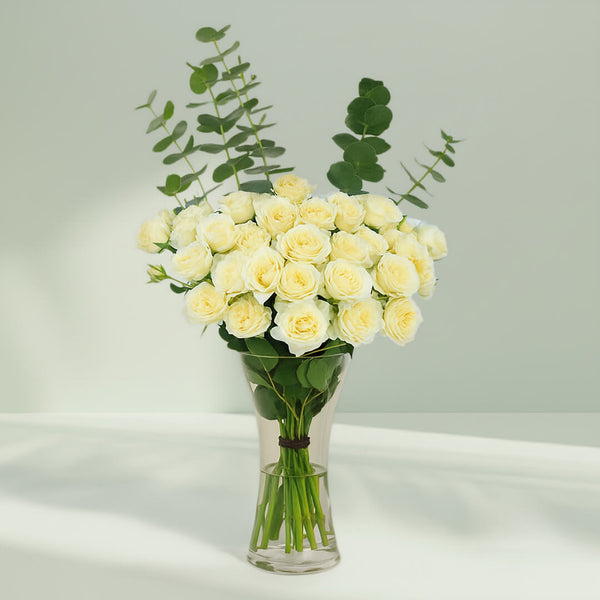 White Roses with Eucalyptus Vase arranged with 20 white roses and eucalyptus