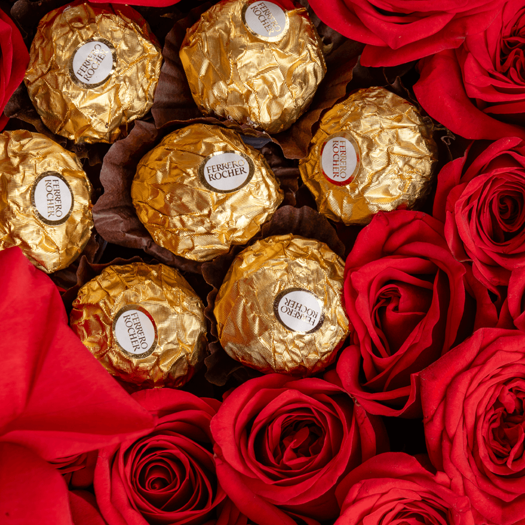 Heart-shaped box with 35 red roses and eight Ferrero Rocher chocolates