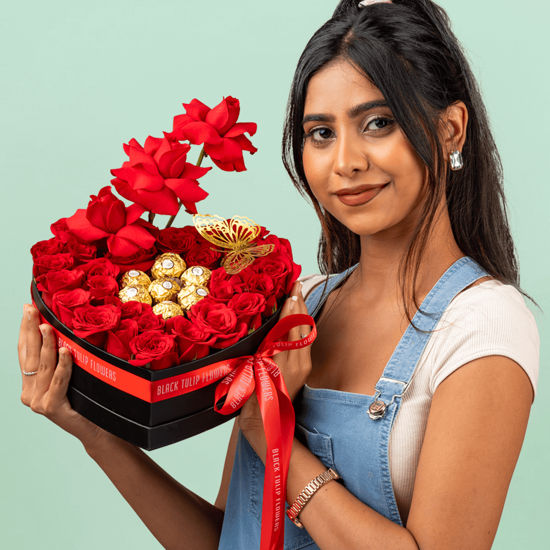 Heart-shaped box with 35 red roses and eight Ferrero Rocher chocolates