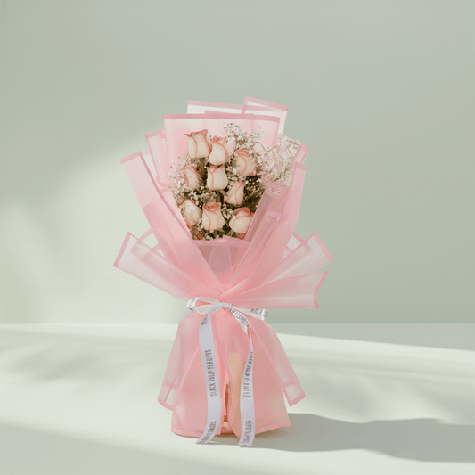 8 pink roses with gypsophila wrapped in pastel Korean floral sheet