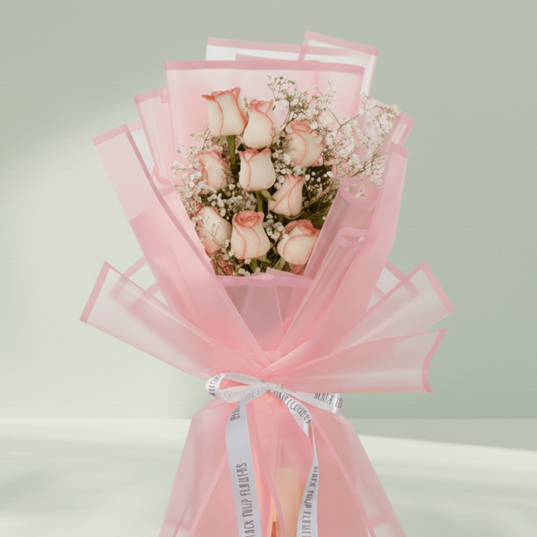 8 pink roses with gypsophila wrapped in pastel Korean floral sheet