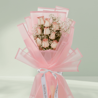 8 pink roses with gypsophila wrapped in pastel Korean floral sheet
