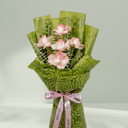 5 light pink roses bouquet with eucalyptus in green wrapping