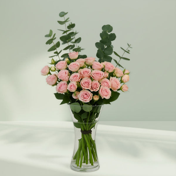 Pink Roses with Eucalyptus Vase arranged with 20 pink roses and eucalyptus