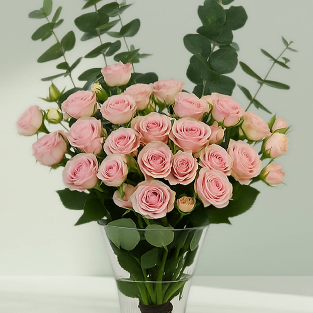 Pink Roses with Eucalyptus Vase arranged with 20 pink roses and eucalyptus