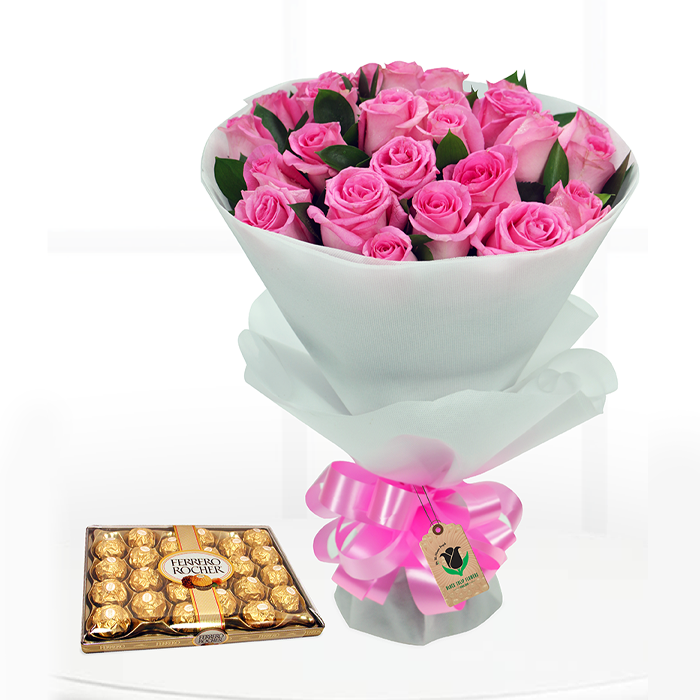 Bouquet featuring pink roses in elegant white wrapping, finished with a pink ribbon and paired with a Ferrero Rocher chocolate box.