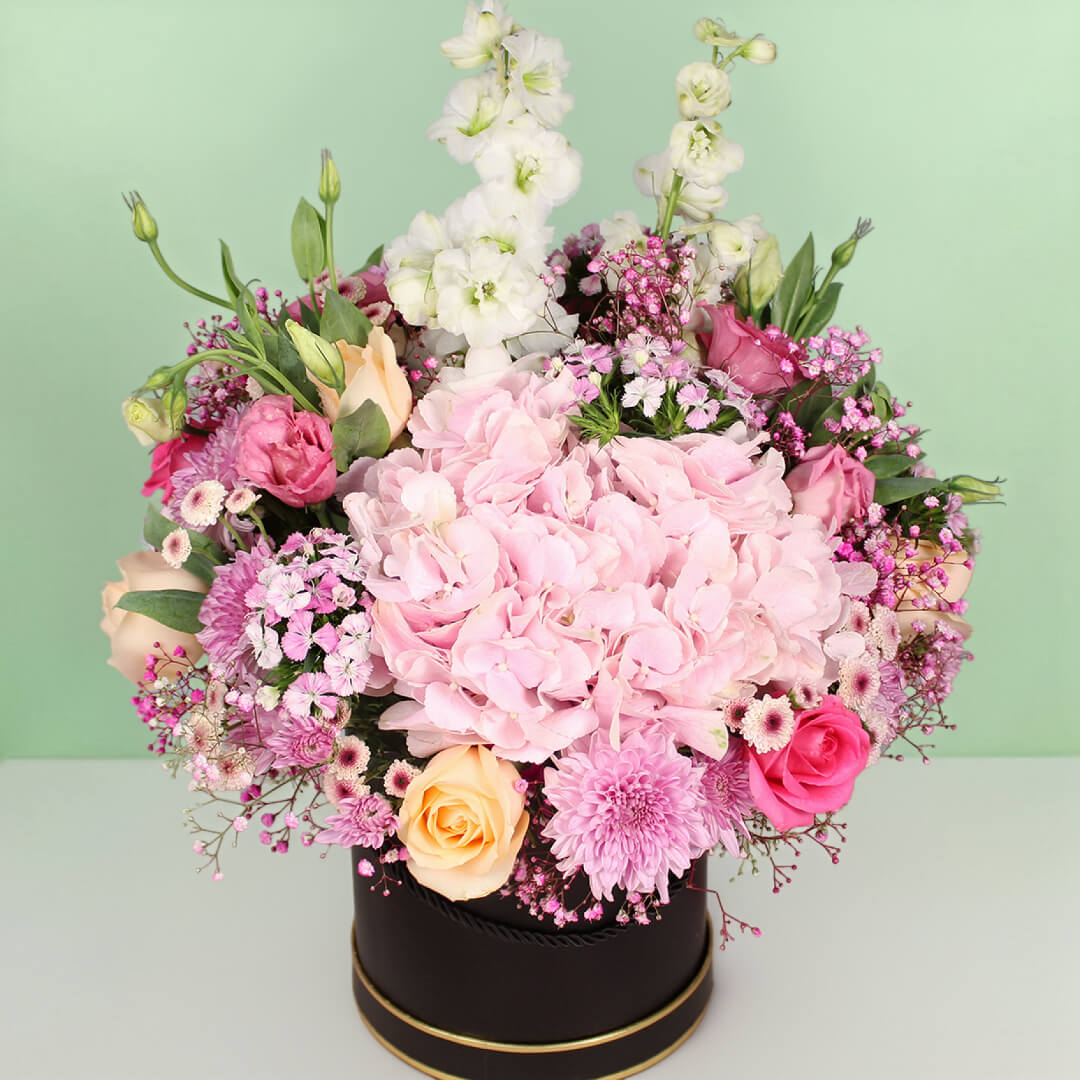 Pastel flower box with Rakhi and Ferrero Rocher chocolates for Raksha Bandhan gift
