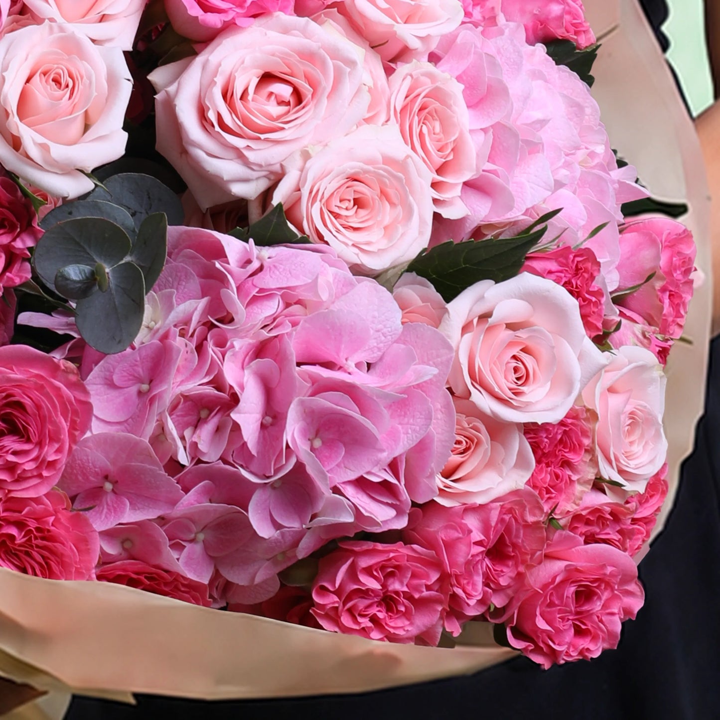 Pink dual flower hand bouquet with fresh pink blooms and elegant wrapping