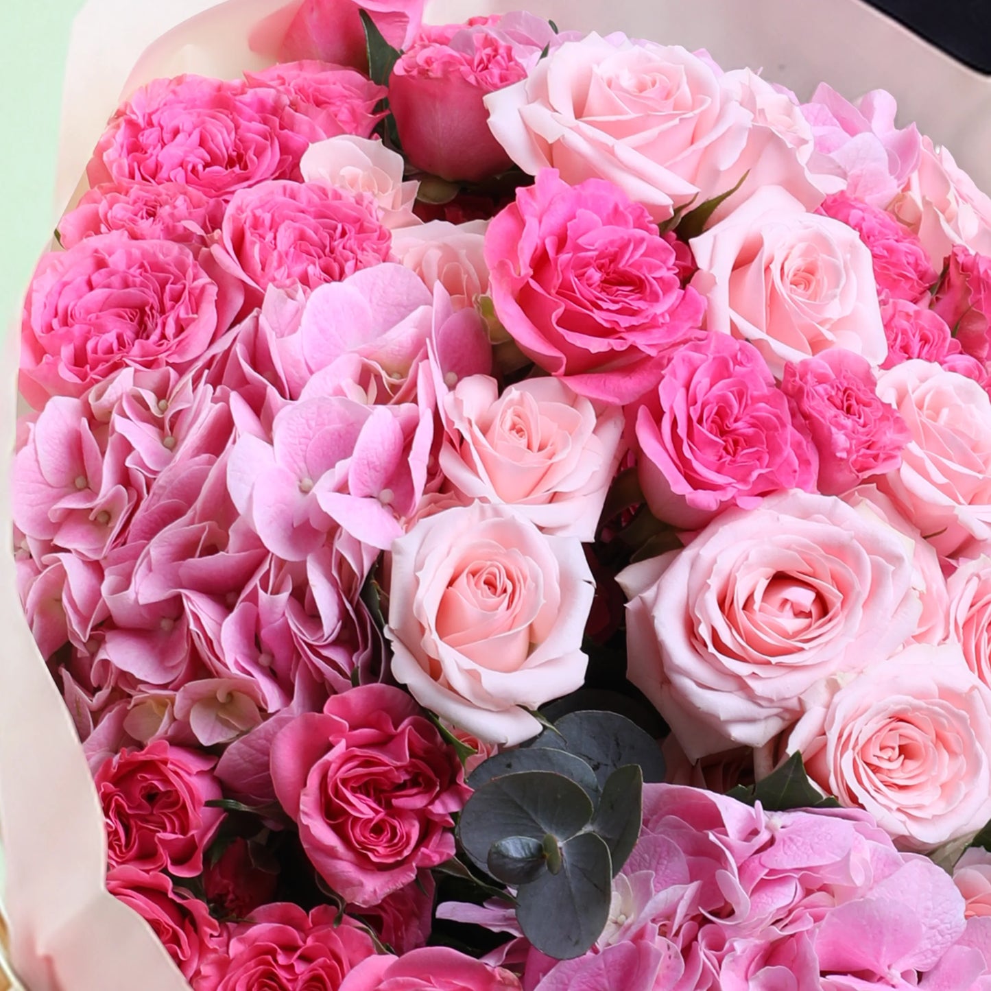 Pink dual flower hand bouquet with fresh pink blooms and elegant wrapping
