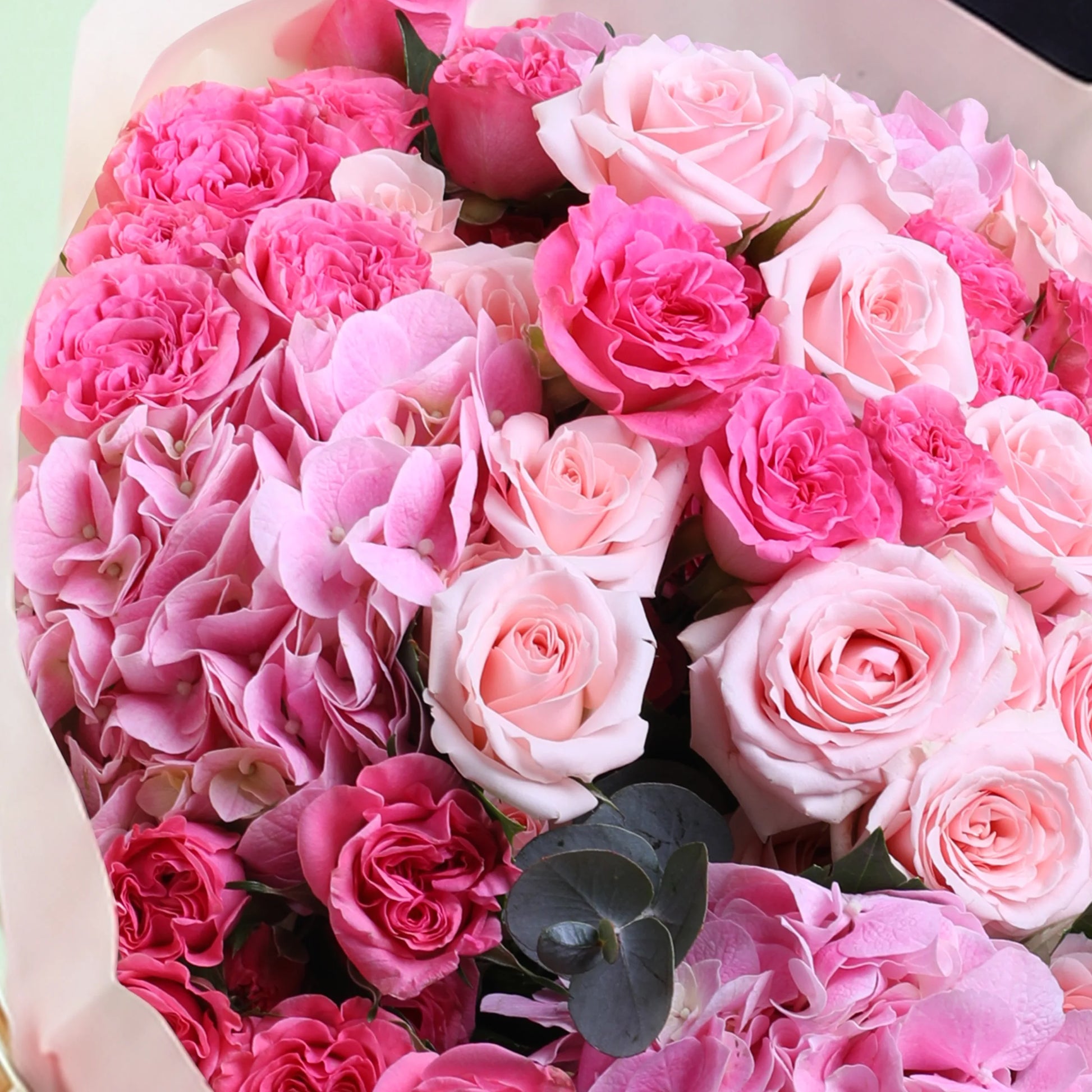 Pink dual flower hand bouquet with fresh pink blooms and elegant wrapping
