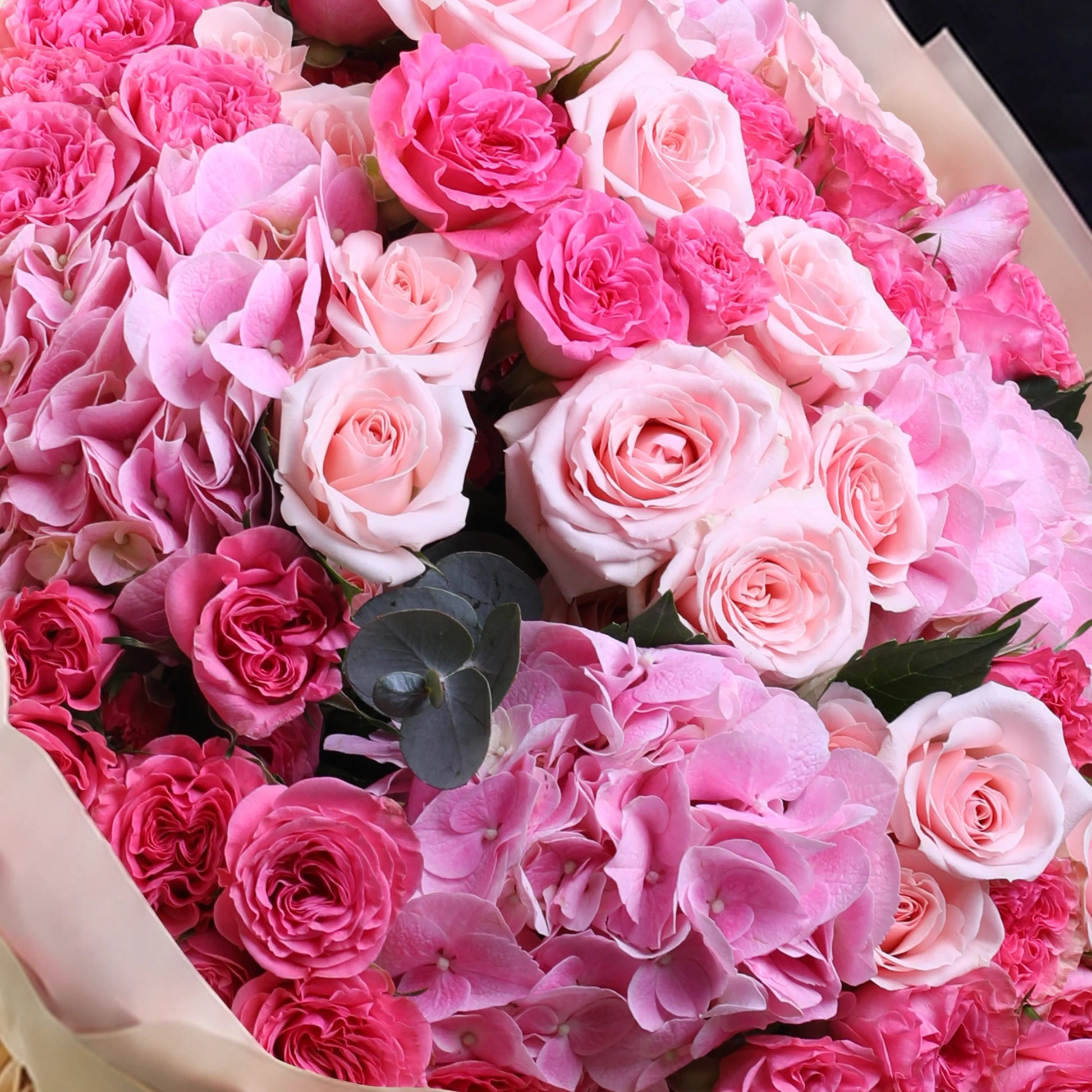 Pink dual flower hand bouquet with fresh pink blooms and elegant wrapping
