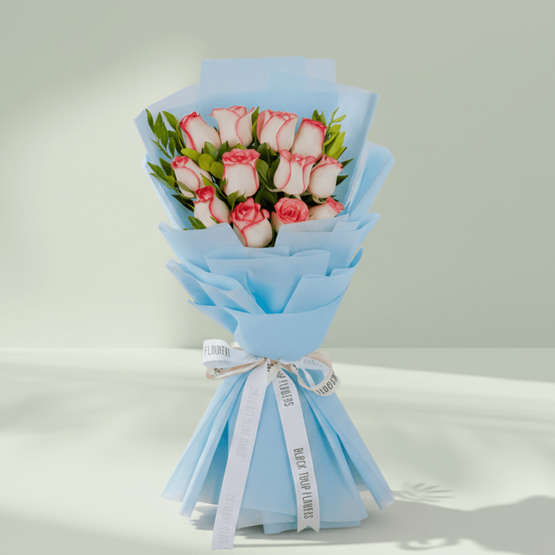 Pink Roses Bouquet arranged with 12 pink roses with green foliage