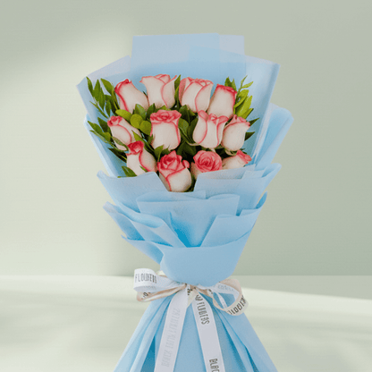 Pink Roses Bouquet arranged with 12 pink roses with green foliage