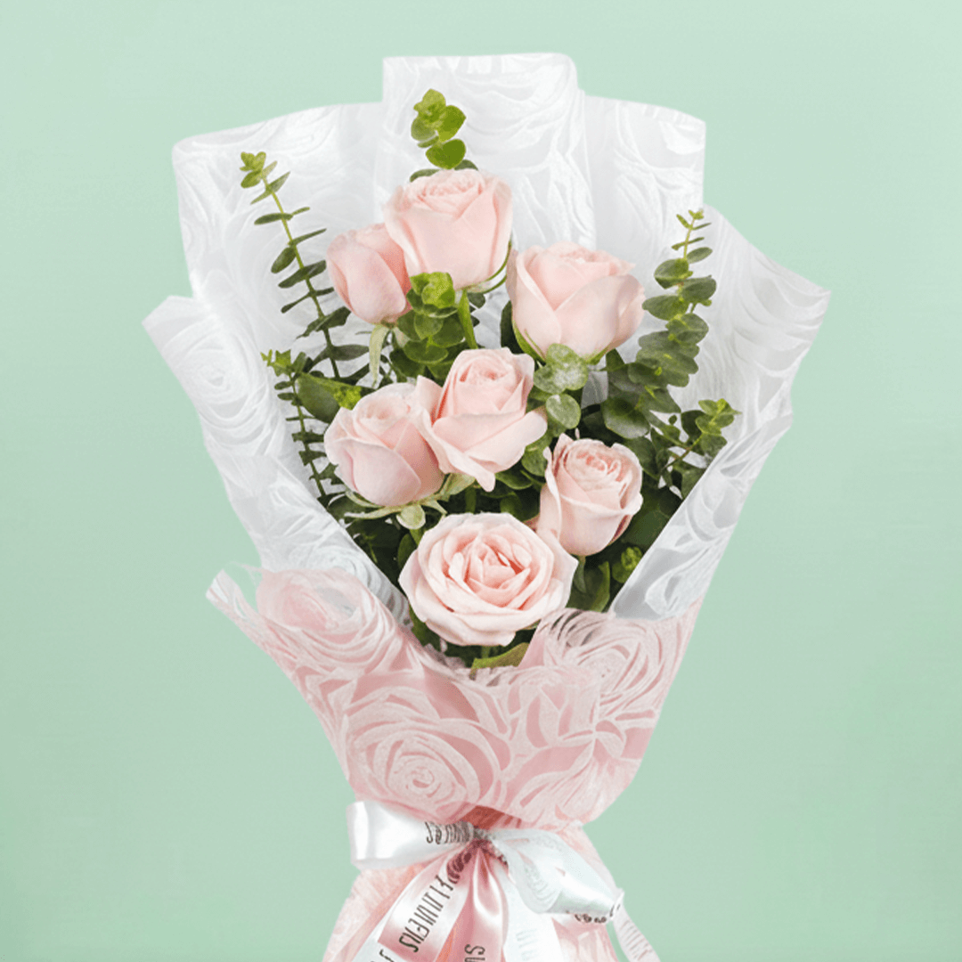 7 pink roses bouquet with eucalyptus in pink wrapping
