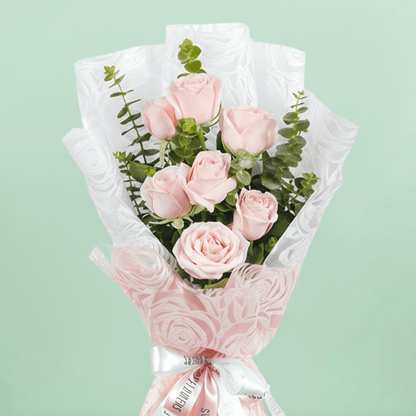 7 pink roses bouquet with eucalyptus in pink wrapping