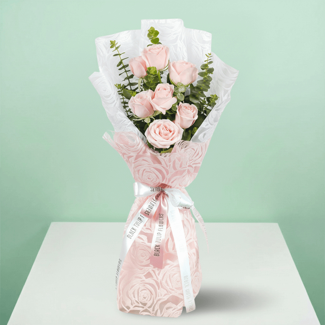 7 pink roses bouquet with eucalyptus in pink wrapping