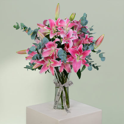 Pink Lily and Eucalyptus Flower Arrangement in Glass Vase