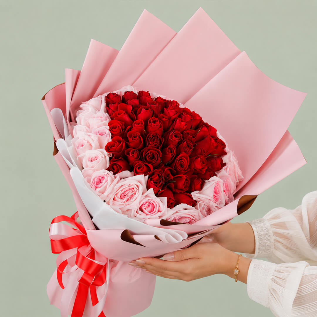 Pink and red hand bouquet of fresh flowers for gifting