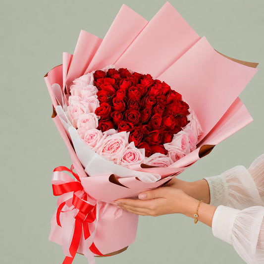 Pink and red hand bouquet of fresh flowers for gifting