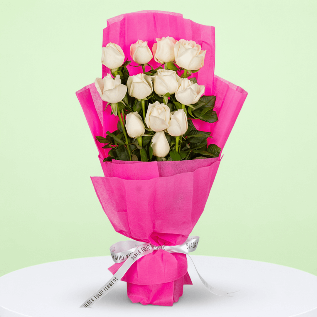 Classic 12 White Roses Bouquet arranged with 12 white roses with deep green foliage
