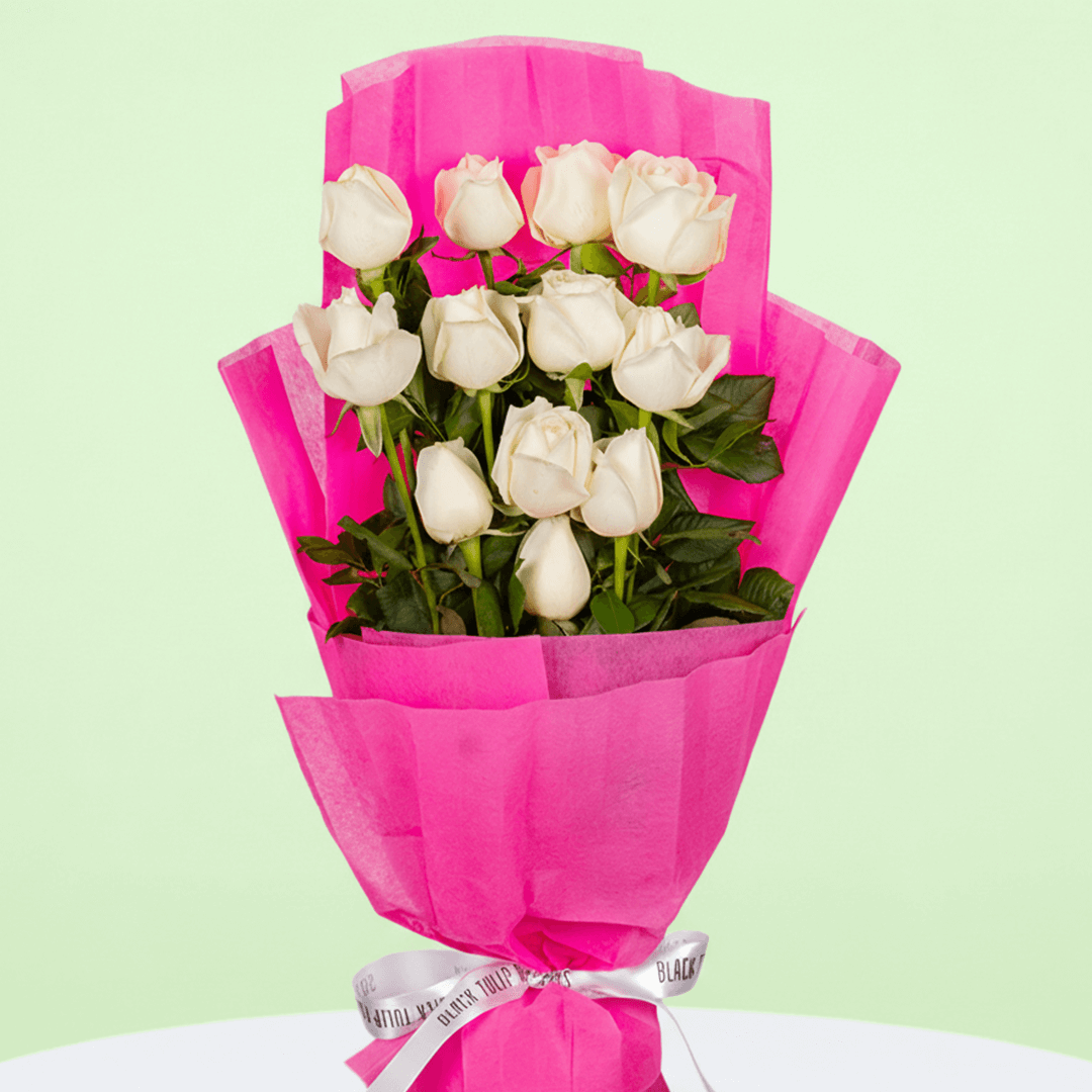 Classic 12 White Roses Bouquet arranged with 12 white roses with deep green foliage