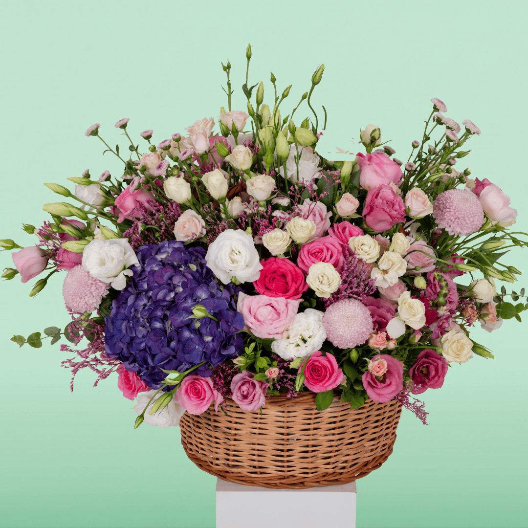 Large assorted flower basket with Hydrangeas, Roses, Eustoma, Chrysanthemums, Limonium and Snapdragons.