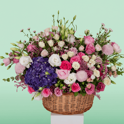 Large assorted flower basket with Hydrangeas, Roses, Eustoma, Chrysanthemums, Limonium and Snapdragons.