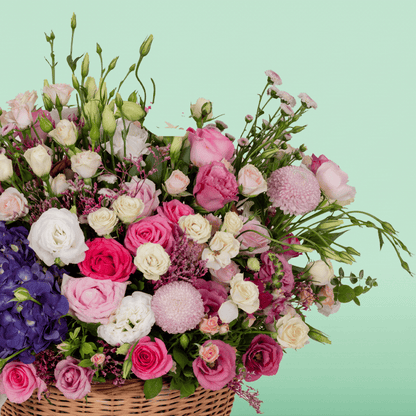 Large assorted flower basket with Hydrangeas, Roses, Eustoma, Chrysanthemums, Limonium and Snapdragons.
